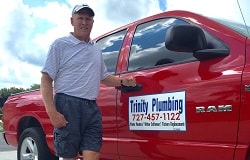Trinity Plumbing of Tampa Bay owner next to truck